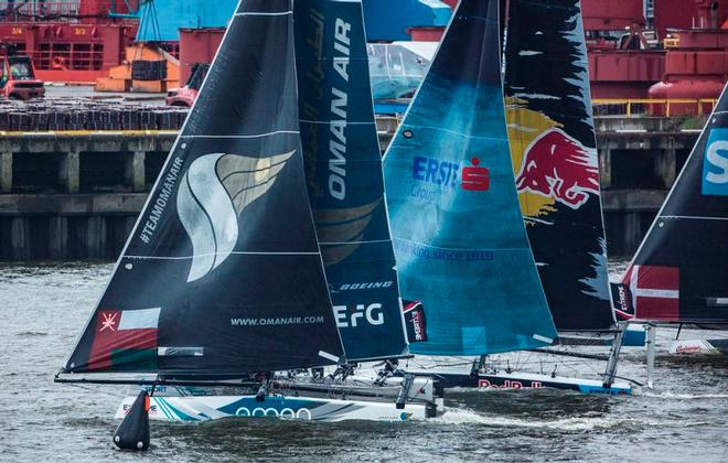 Act 5, Extreme Sailing Series Hamburg – Day 3 – Oman Air maintained its lead while Red Bull Sailing Team climbed from bottom of the table to second after seven nail-biting races. ©  Lloyd Images